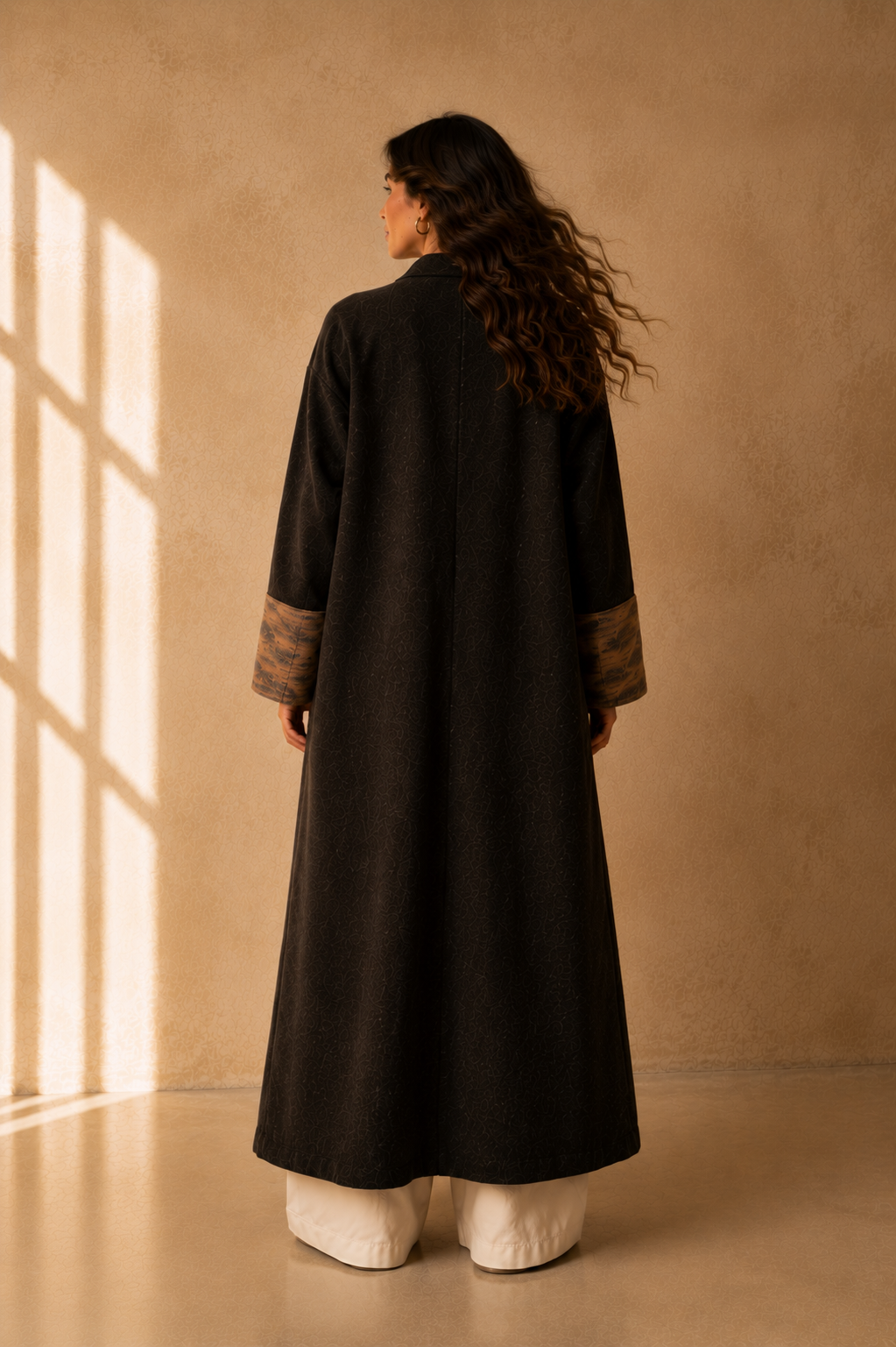 Nuno Milano brown felted Merino wool robe coat, back view, full-length flowing silhouette with contrasting bronze-brown turned-back cuffs