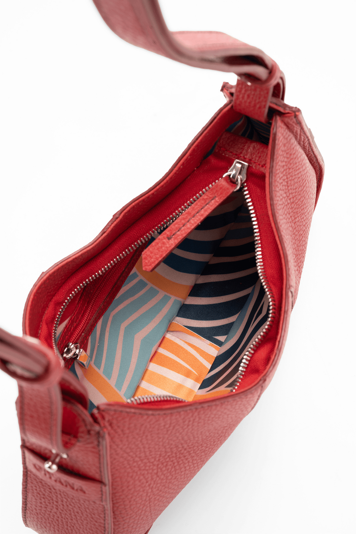 A close-up of a red textured leather handbag shown open, revealing a colorful striped interior lining with navy, orange, and light blue wavy patterns. The brand name 'Gitana' is subtly embossed on the lower left corner of the red leather.