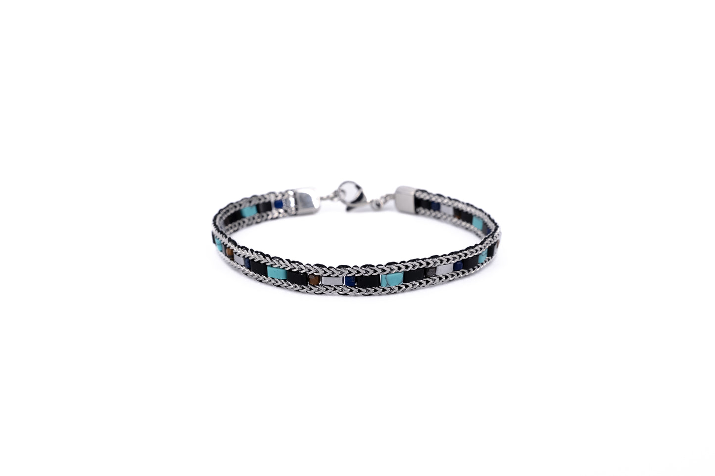 Men's woven stainless steel chain bracelet with turquoise and black stone tile accents and lobster clasp fastening on white background