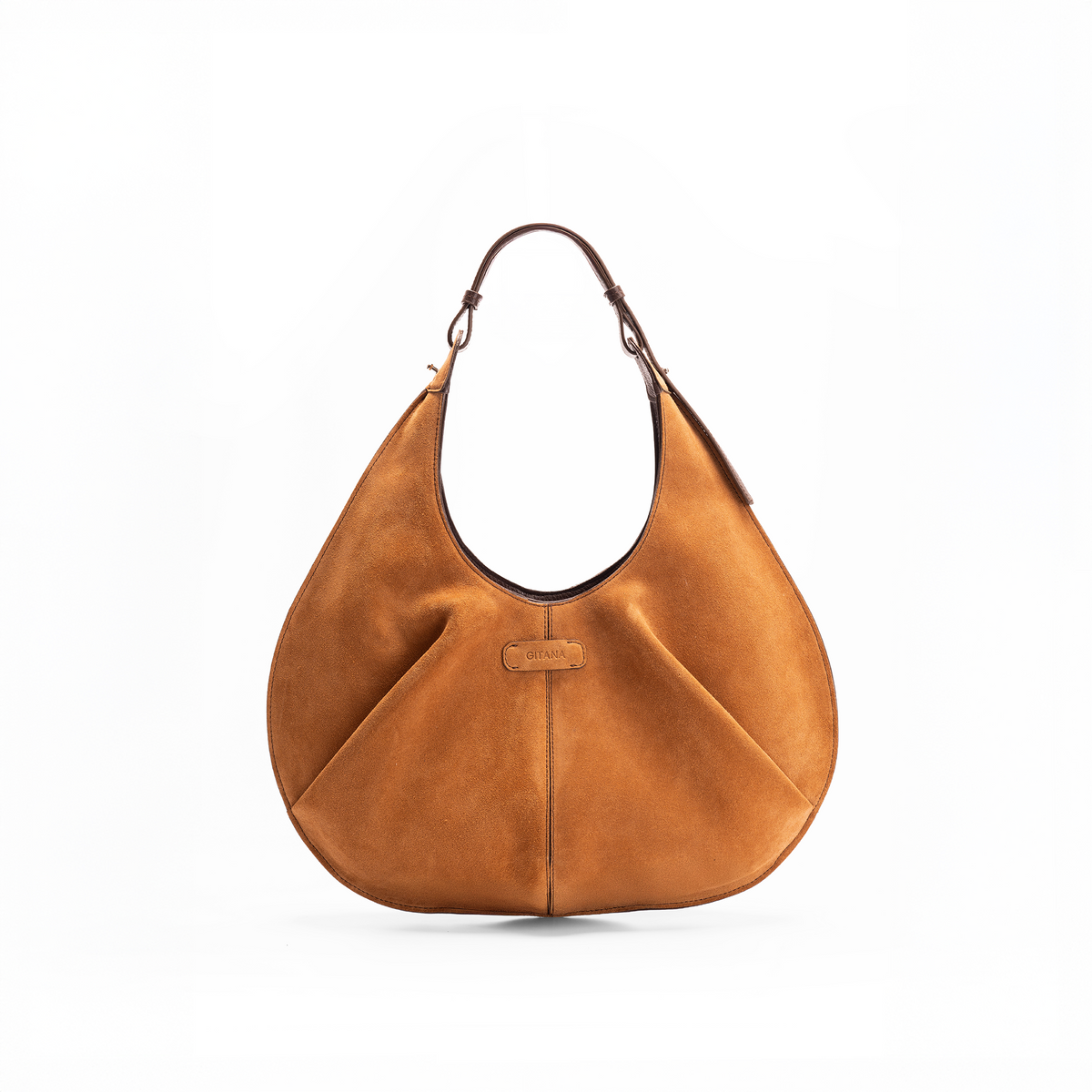 Front view of a large red luxury suede tote handbag on a white background. holding a red suede Gitana tote red suede leather bag, wearing blue cotton jeans, a light blue blouse, and a patterned headscarf.