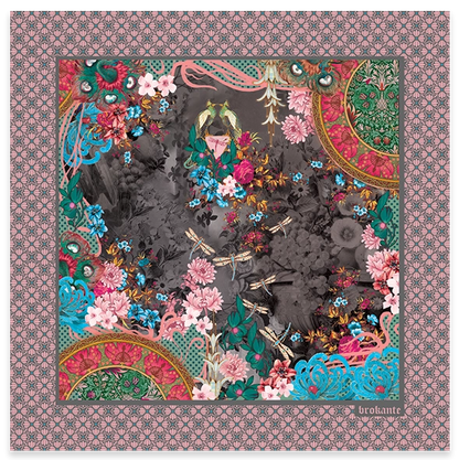 Camélia Anthracite cashmere and modal square scarf laid out flat, with pink camellias, red roses, turquoise flowers, golden dragonflies and two small birds on a smoky charcoal-grey floral centre, coral and gold half medallions in two corners, and a pink border with a grey floral lattice pattern.