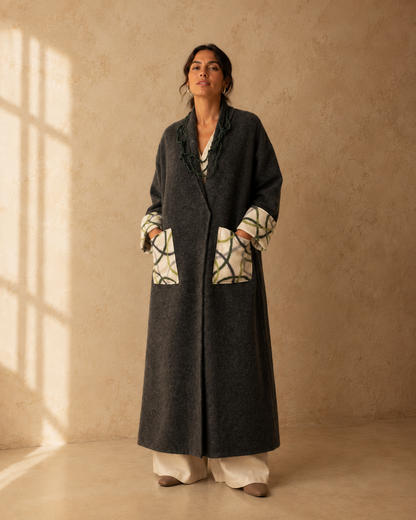 Nuno Milano dark charcoal felted Merino wool robe coat, front view, with contrasting cream and green abstract-print pockets and cuffs