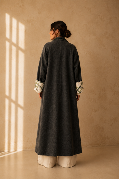 Nuno Milano dark charcoal felted Merino wool robe coat, back view, full length silhouette with contrasting cream and green cuffs