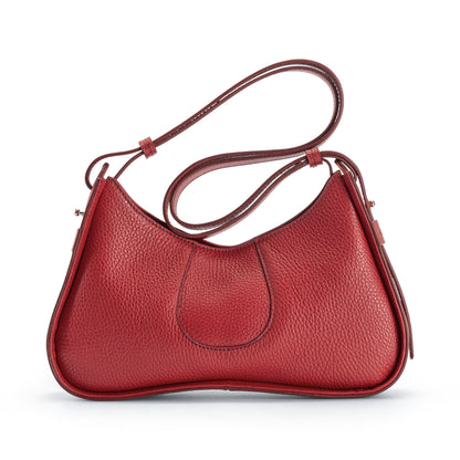 A red pebbled leather shoulder bag with a curved, crescent-shaped silhouette, a single shoulder strap, and a central stitched detail, shown on a plain white background.
