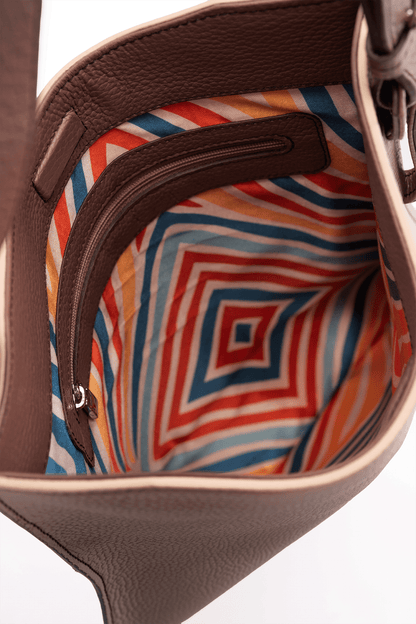 Simona Crossbody Bag Close-up of a the colorful geometric pattern inside.