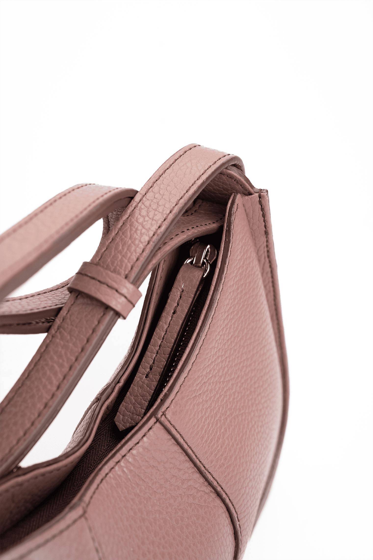 Close-up of a toast brown handbag with a strap on a white background