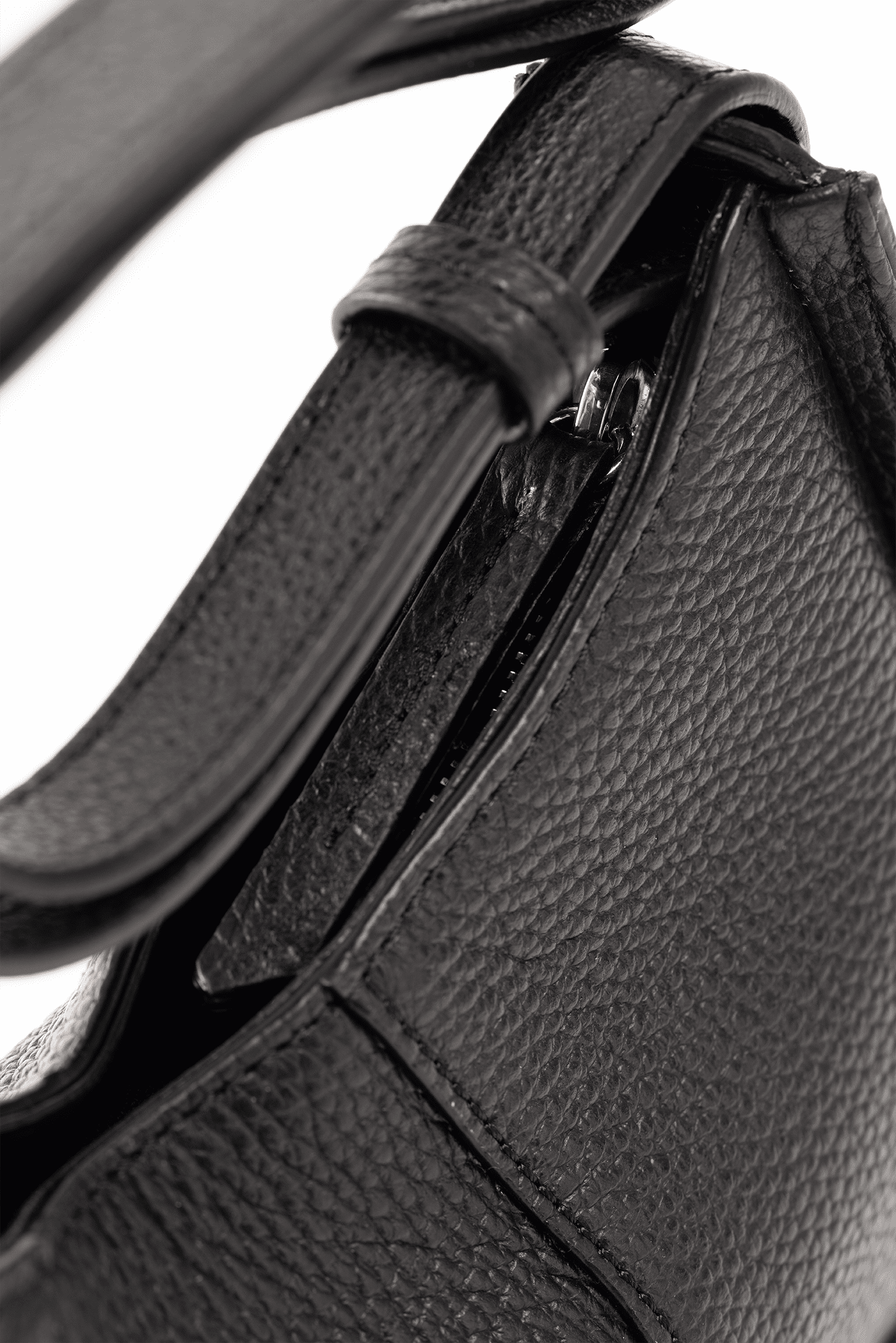 Close-up of a Black Italian Pebble Calf Leather handbag with Focus on a handle.