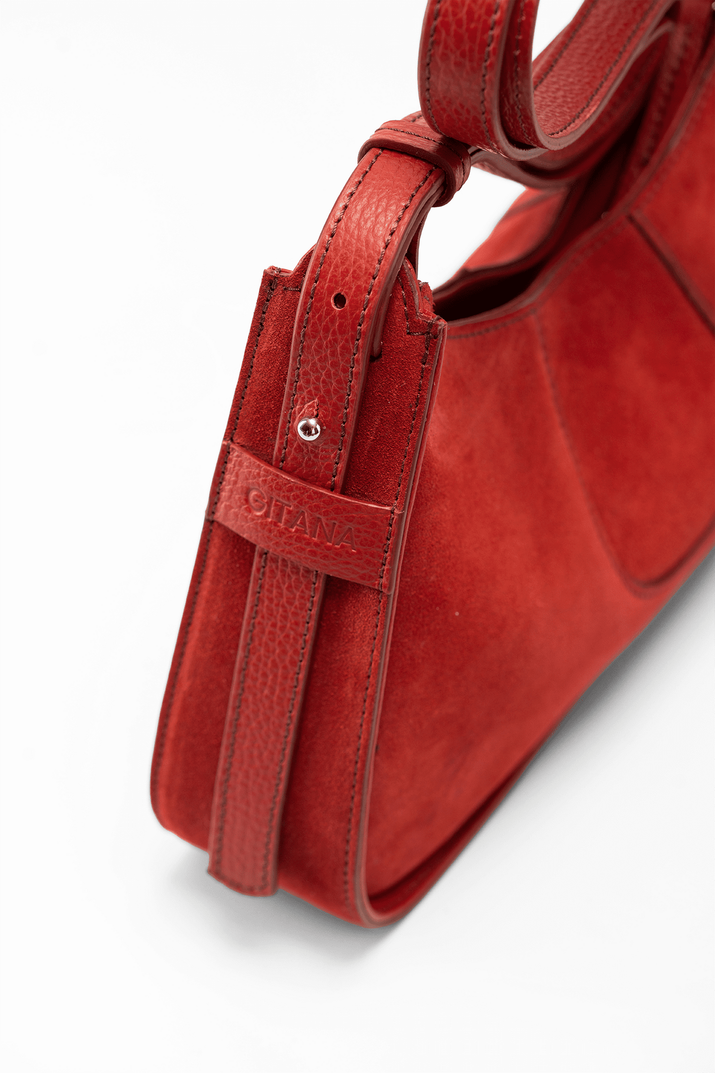 The Close-Up Side View of Aria Shoulder Bag in Red Italian Suede Leather with Red Pebbled Leather Trim. 