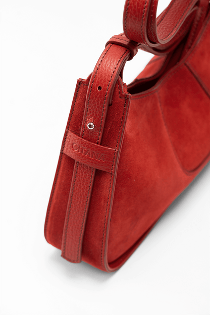 The Close-Up Side View of Aria Shoulder Bag in Red Italian Suede Leather with Red Pebbled Leather Trim. 