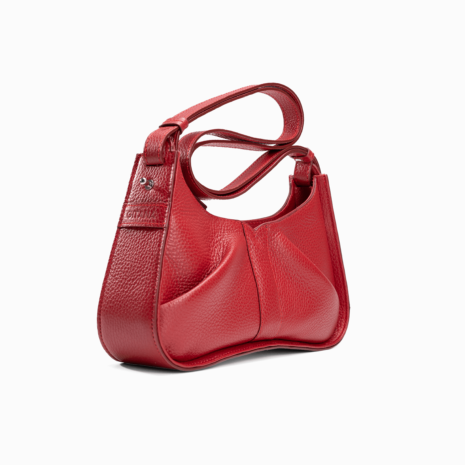 Close-up of the gusset of a luxury red leather shoulder bag with the Gitana branding and a swirl shoulder strap.