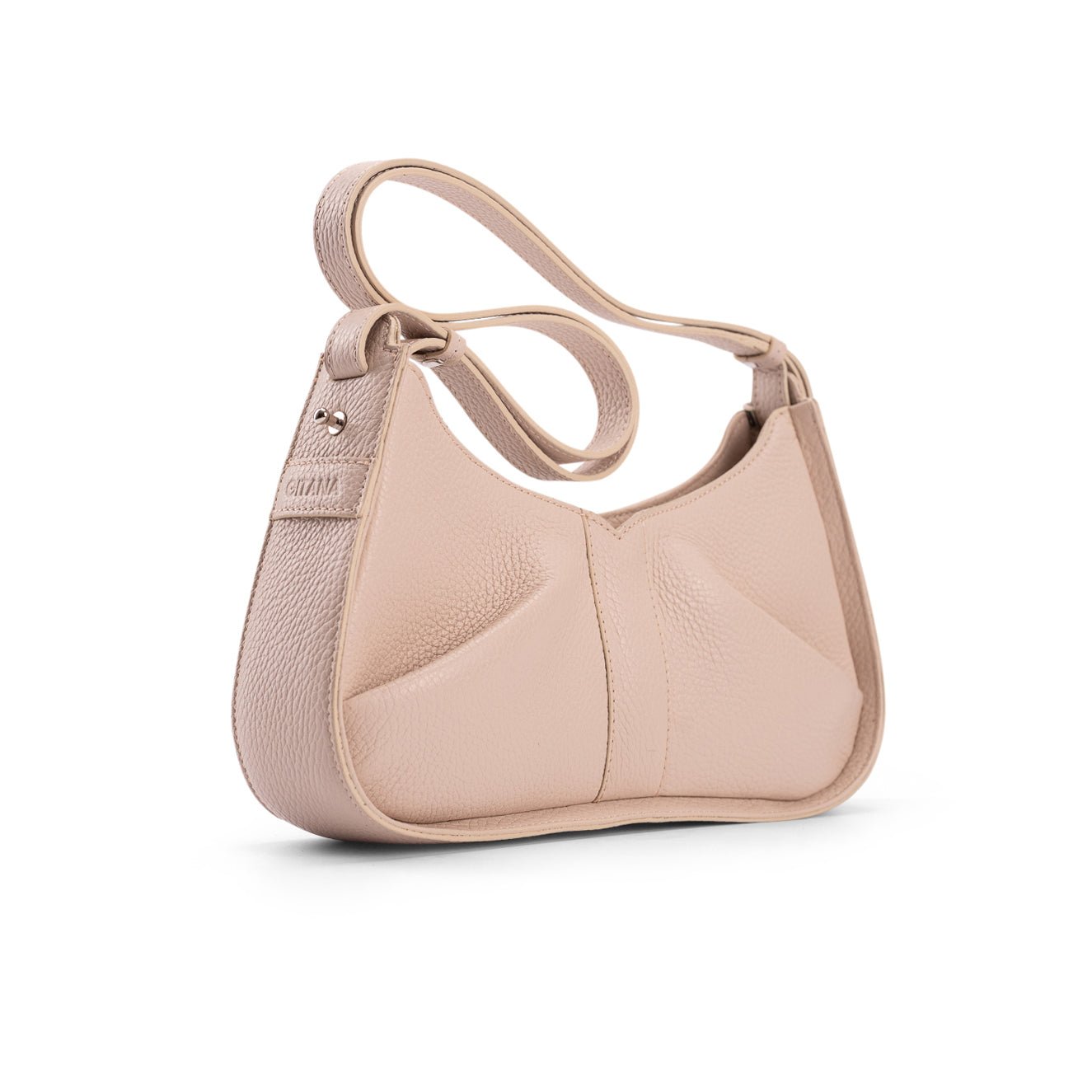 The Side View of Isla Shoulder Bag in Beige Italian Pebble Leather - Side Pleat Detail and "Gitana" Brand