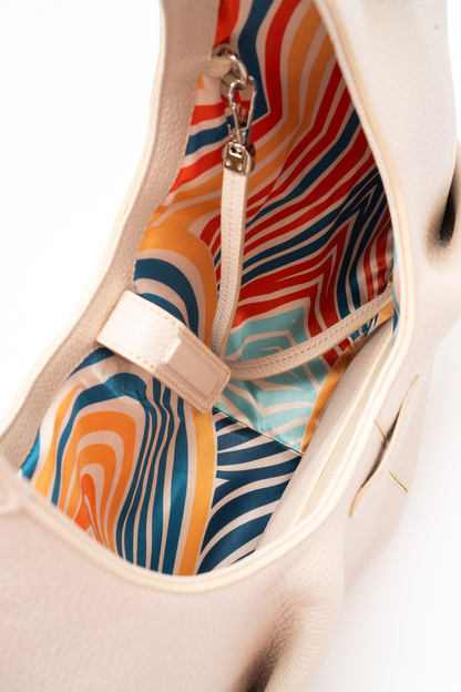 Onda Tote Italian Pebble Calf Leather Focusing on the  Spacious Interior View and the Colourful Geometric Lining.