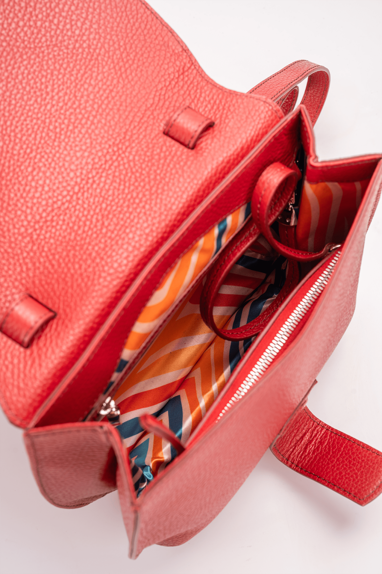 Yara Crossbody Bag in Red Italian Pebble Calf Leather - Interior Compartment Detail and colourful geometric lining.