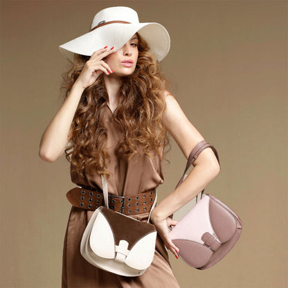 Woman holding two handbags against a beige background