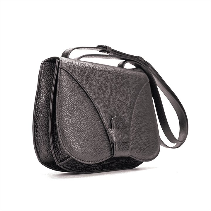 Side view of a designer luxury medium-sized black Italian pebble calf leather women’s handbag.
