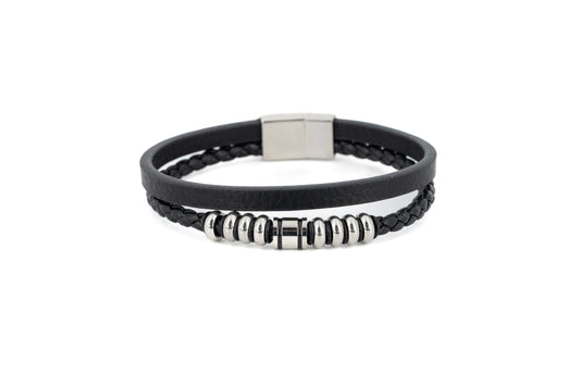 Black double-strand leather bracelet with smooth and braided strands, polished silver stainless steel centre rings and magnetic snap closure on white background