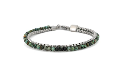 Men's bracelet with genuine African turquoise stone beads and polished stainless steel box chain, with lobster clasp fastening on white background