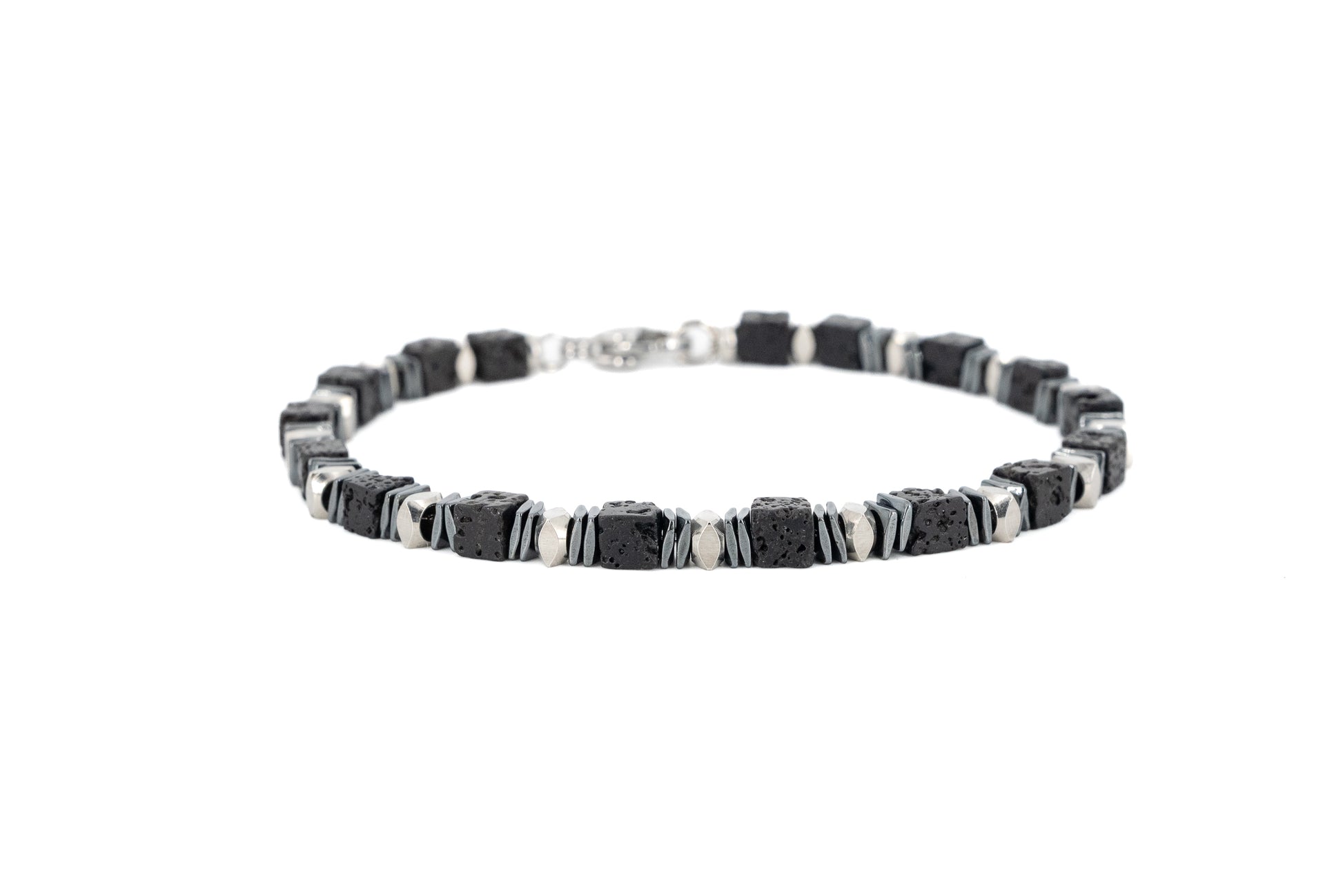 Men's bracelet with square black lava stone beads and polished stainless steel accents, with lobster clasp fastening on white background