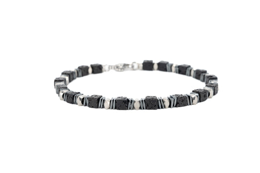 Men's bracelet with square black lava stone beads and polished stainless steel accents, with lobster clasp fastening on white background