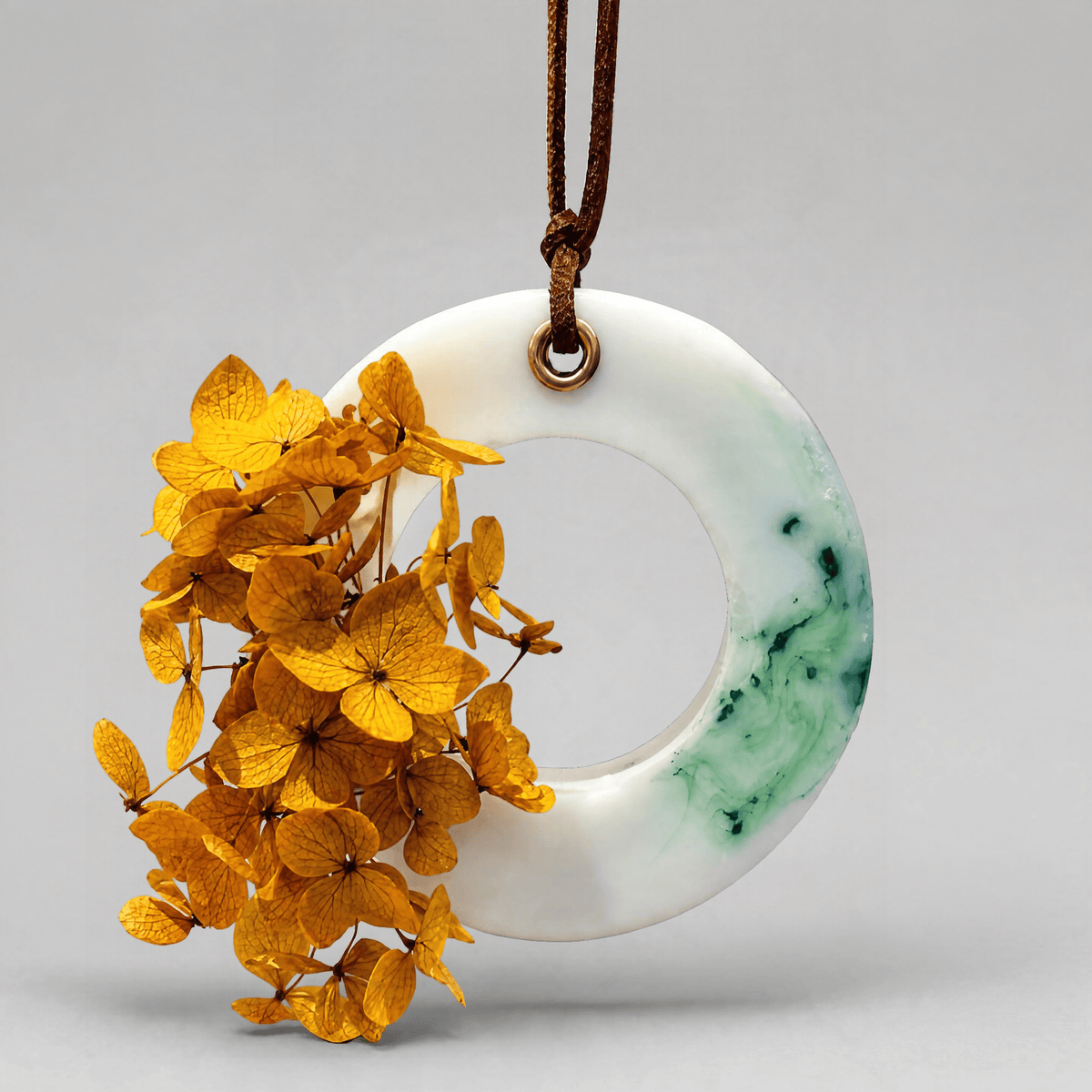 A Lime Fusion scented cupboard wax tablet with a leather string on a white background
