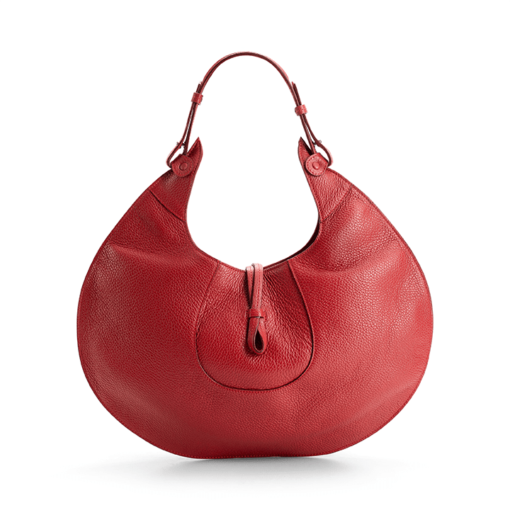 The back view of a red luxury designer pebble calf tote bag, showcasing the curved designer silhouette against a white background.