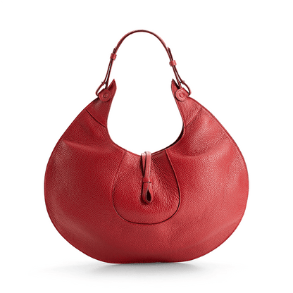 The back view of a red luxury designer pebble calf tote bag, showcasing the curved designer silhouette against a white background.