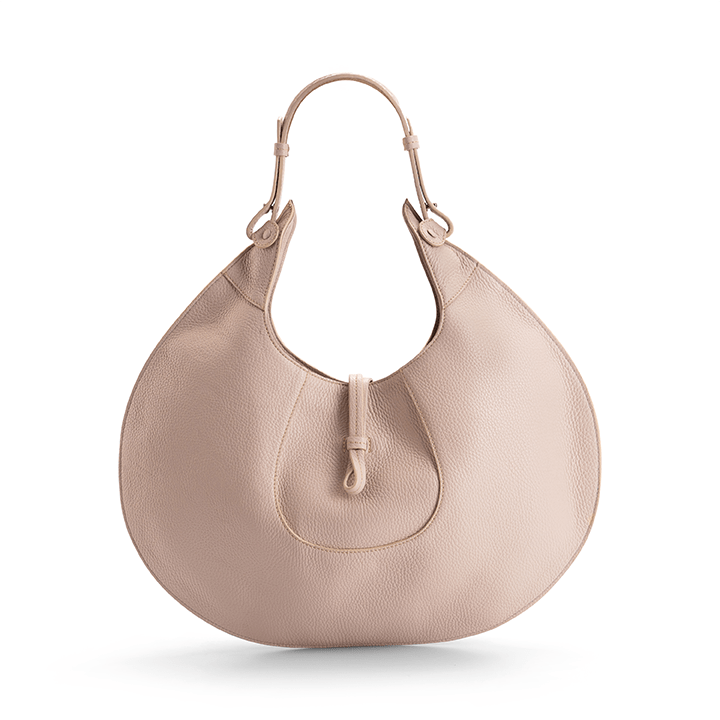 The back view of a beige luxury designer pebble calf tote bag, showcasing the curved designer silhouette against a white background.