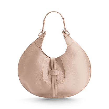 A beige designer luxury pebble calf tote bag, showcasing the curved designer silhouette against a white background.