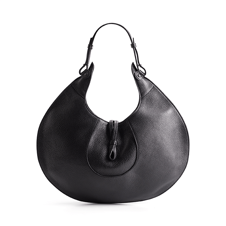 The back view of a black luxury designer pebble calf tote bag, showcasing the curved designer silhouette against a white background.