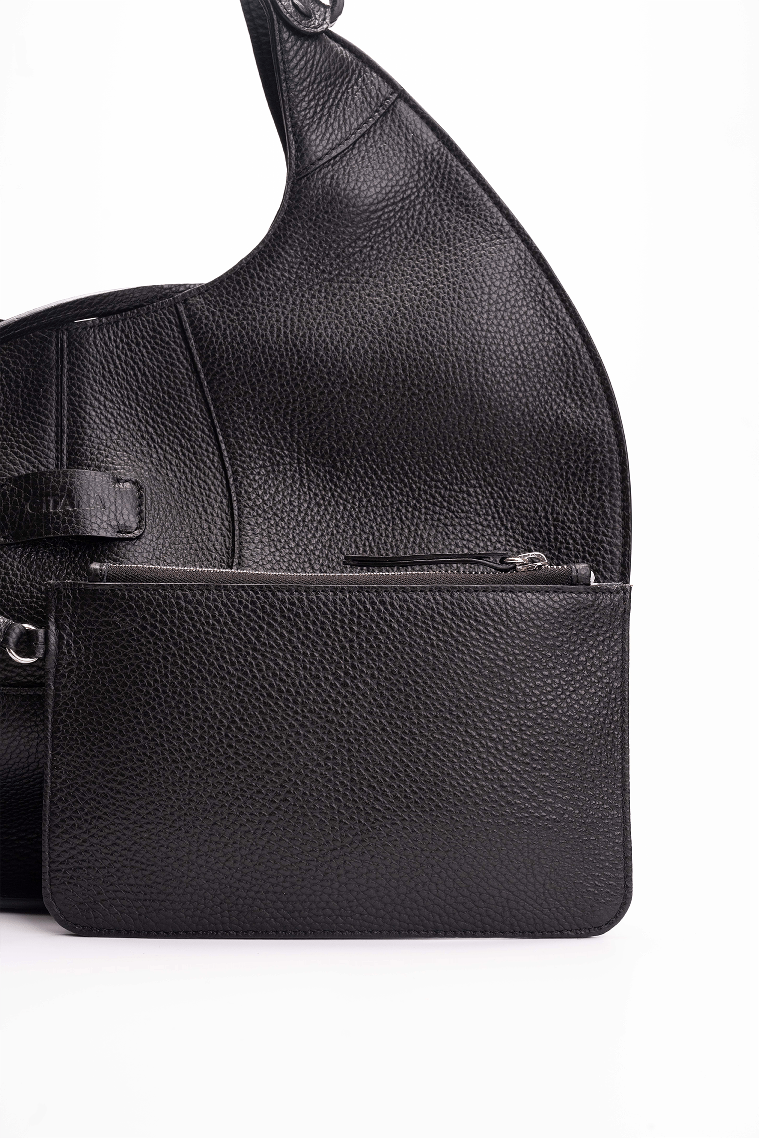 Front view of a black luxury pebble calf tote bag with a matching small pouch attached by a strap, displayed on a white background.