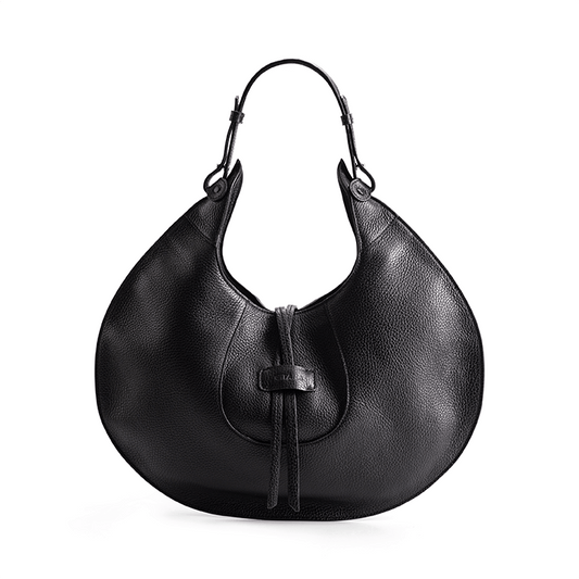 A black designer luxury pebble calf tote bag, showcasing the curved designer silhouette against a white background.
