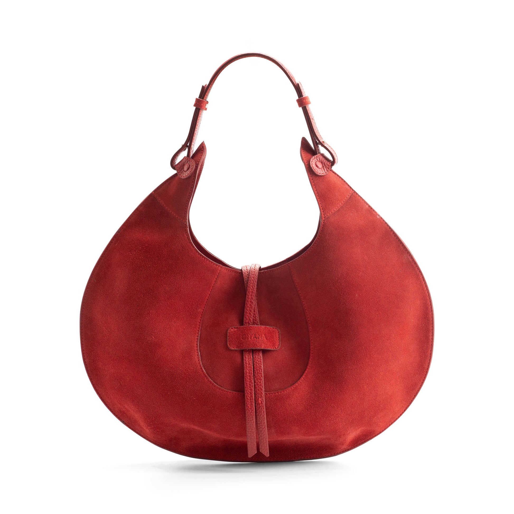 A scarlet designer luxury suede tote bag, showcasing the curved designer silhouette against a white background.