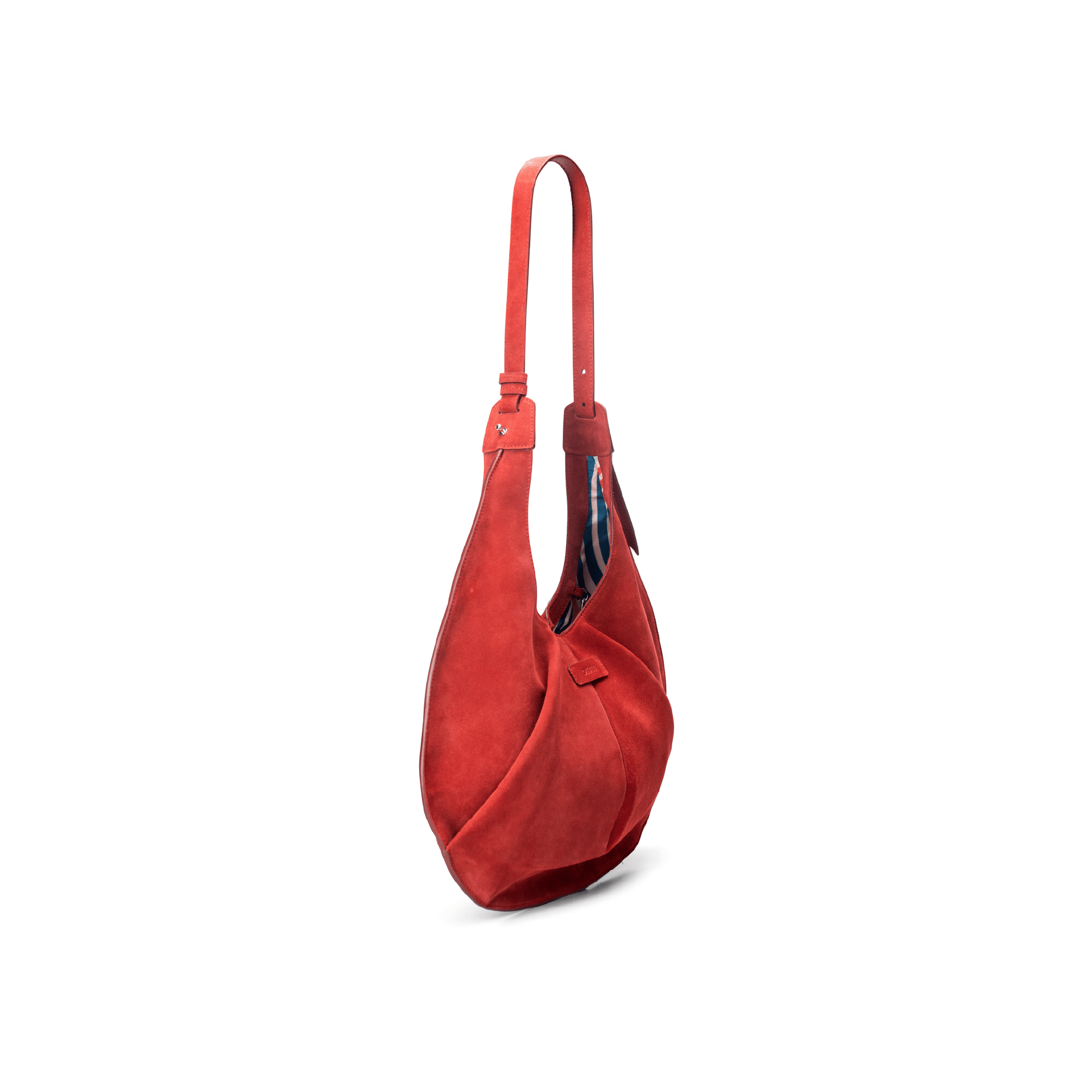 Side view of a large red luxury suede tote handbag on a white background.