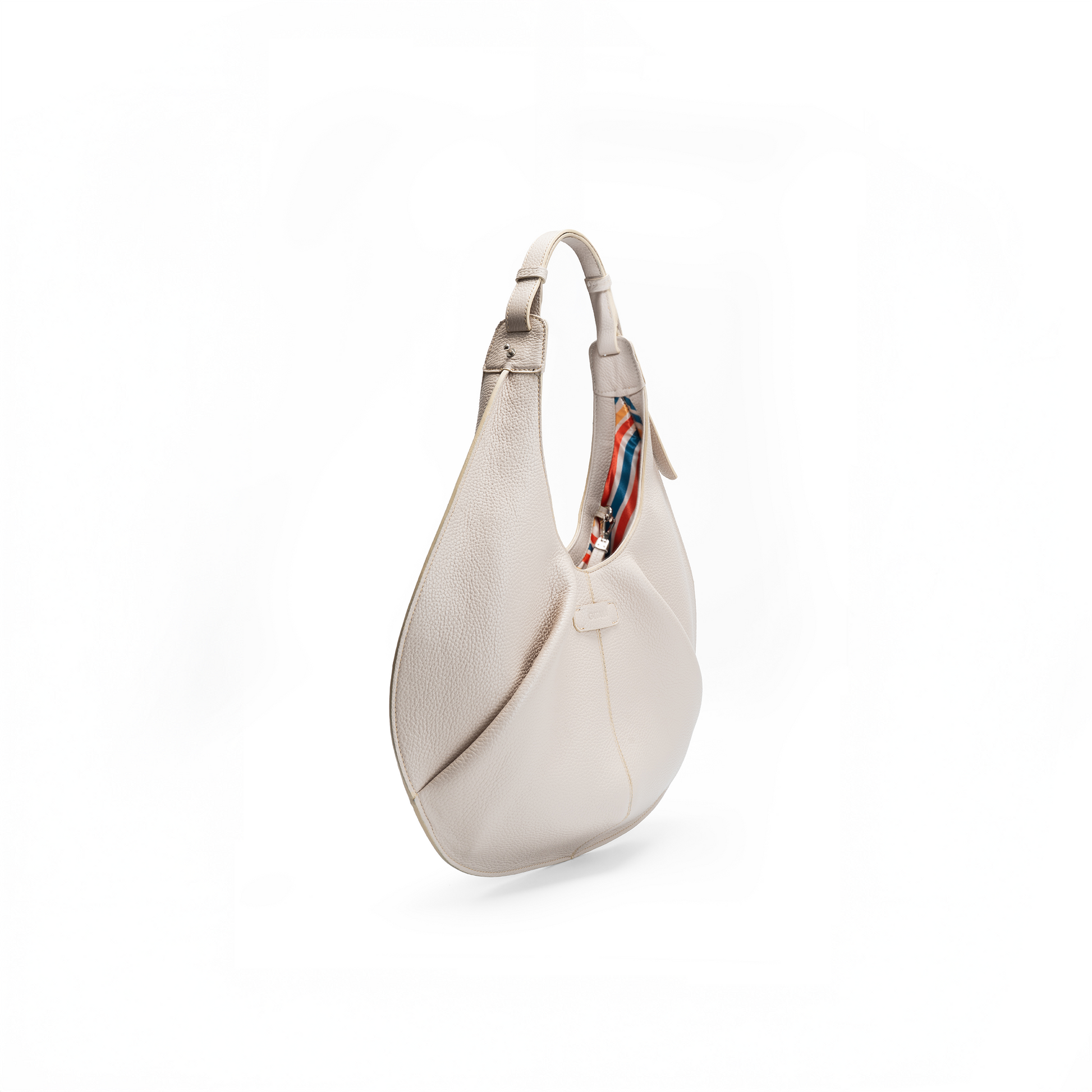 Side view of a large beige luxury Italian pebble calf tote handbag on a white background.