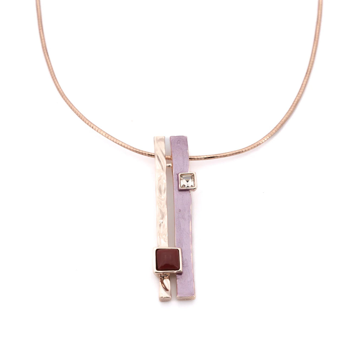 A pendant of two slim bars, one hammered rose gold, one hand-painted in soft lilac, hangs side by side from a brass cable necklace that's twisted on itself for extra shine and character.