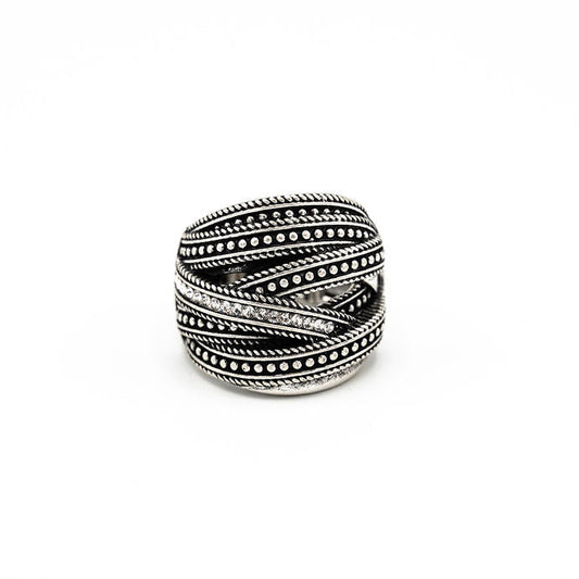 A silver-toned wrap ring with textured twisted bands and rows of small crystals, photographed on a plain white background.