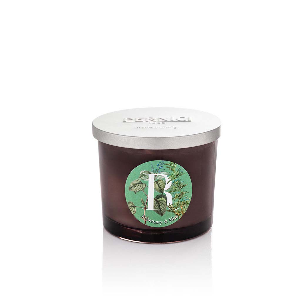 Cereria Pernici Elementi Rosemary & Mint 200g scented candle in a dark amber glass jar with silver Pernici lid and circular botanical herb label on a green background, product shot on white background
