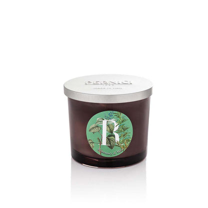 Cereria Pernici Elementi Rosemary & Mint 200g scented candle in a dark amber glass jar with silver Pernici lid and circular botanical herb label on a green background, product shot on white background