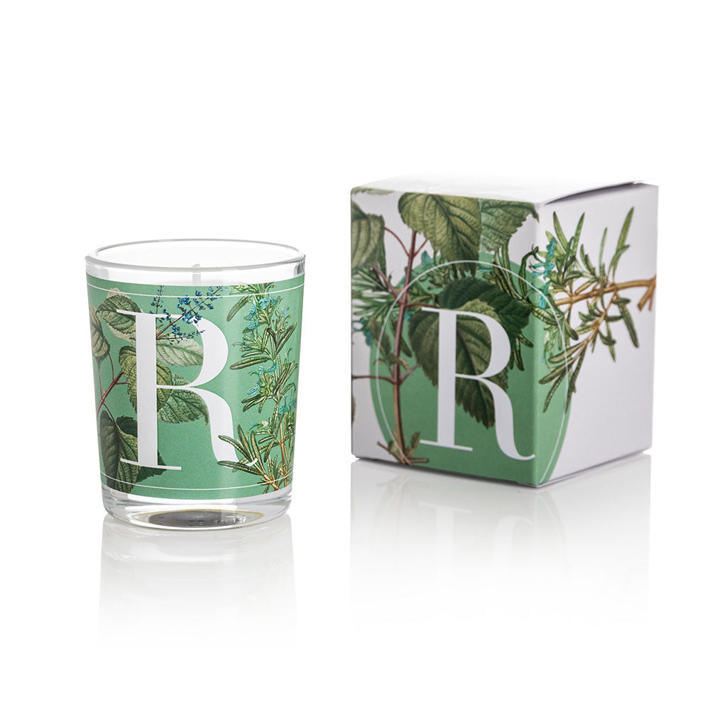 Cereria Pernici Elementi Rosemary & Mint 70g scented candle in a clear glass tumbler with full-wrap botanical rosemary and mint illustration on a green background, shown alongside its matching gift box, product shot on white background