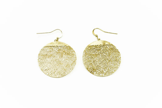 A pair of gold plated filigree earrings with hook on a white background.