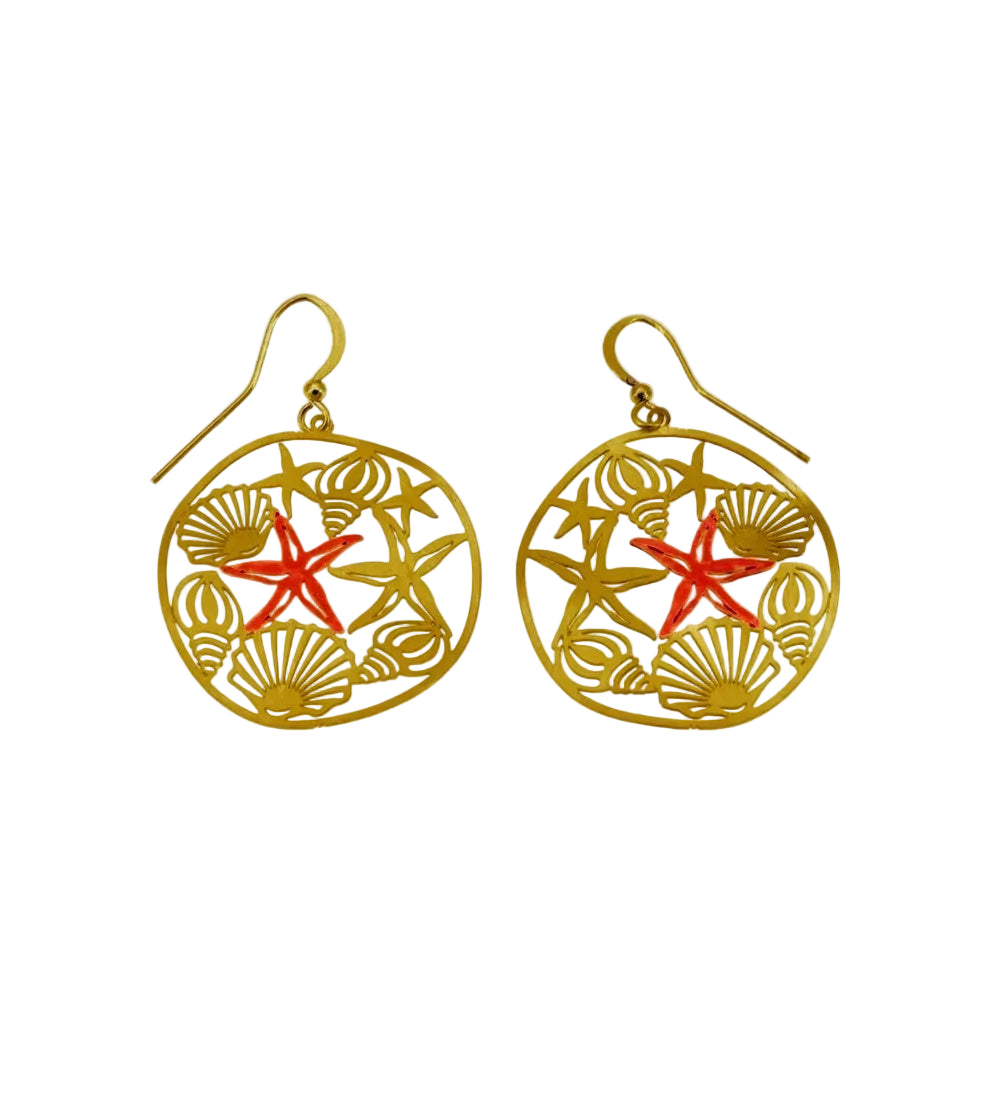 A pair of gold-tone dangle earrings with a circular openwork design featuring seashell and starfish motifs, accented with a coral-red starfish in the center, shown on a plain white background.